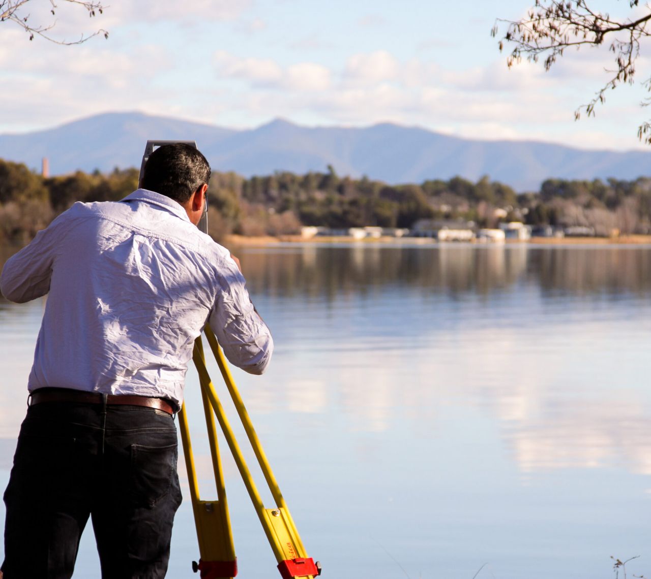 Easement surveyor Canberra conducting cadastral survey with theodolite